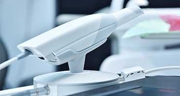 Dental intraoral scanner on table in modern dentist office